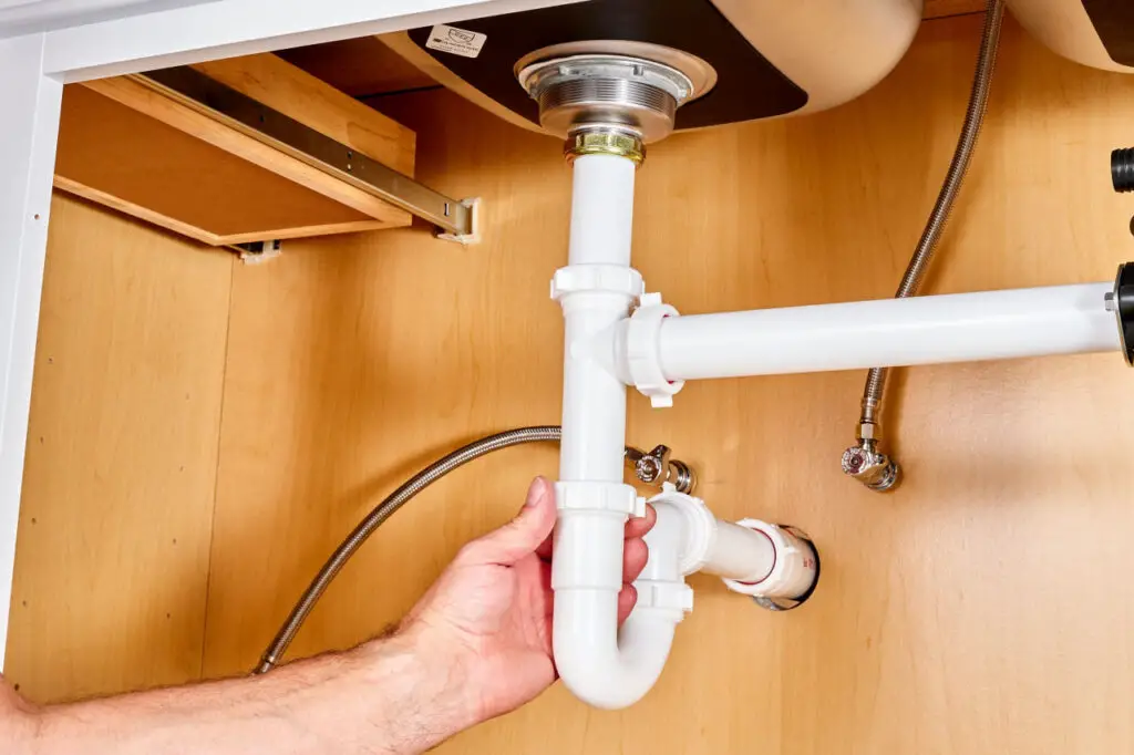 Why kitchen sink clogged past trap?